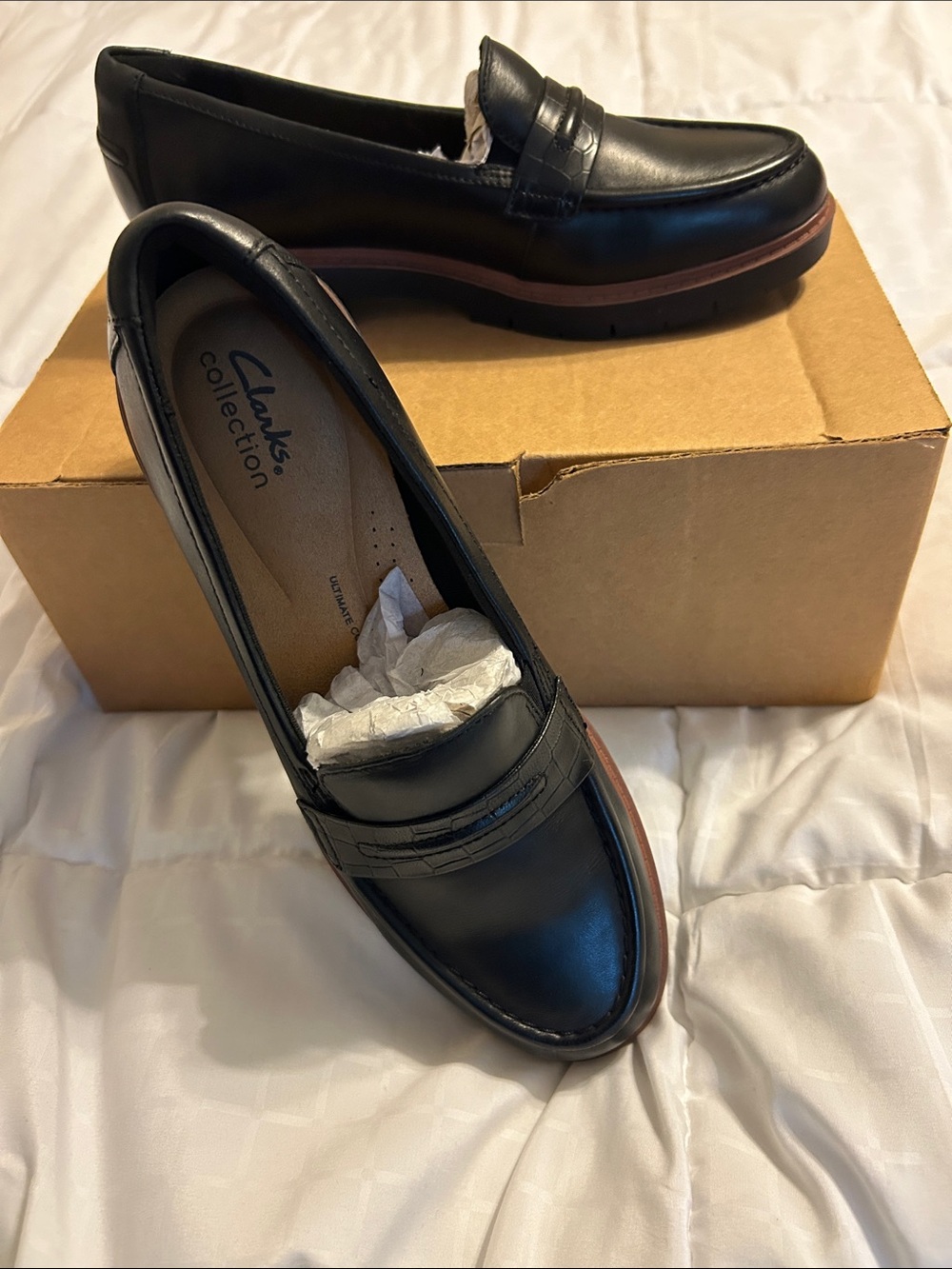 Clarks Black Leather Penny-Style Loafers with Brown Trim